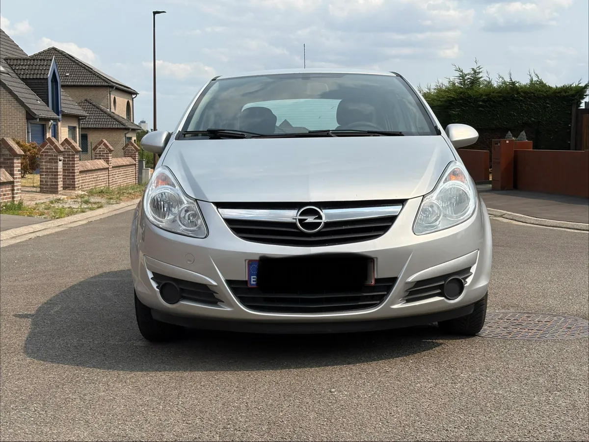 Opel Corsa 2010 — photo 1