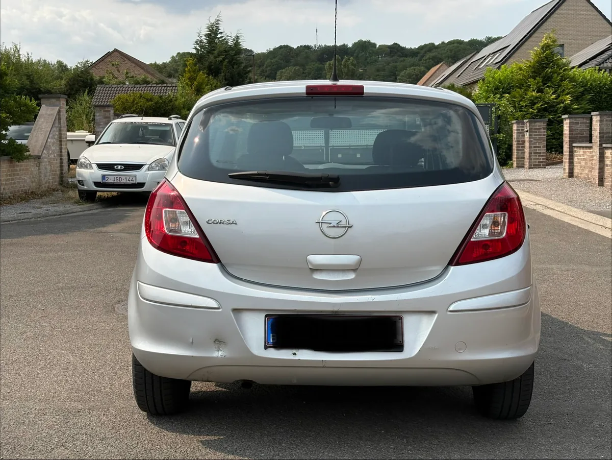 Opel Corsa 2010 — photo 2